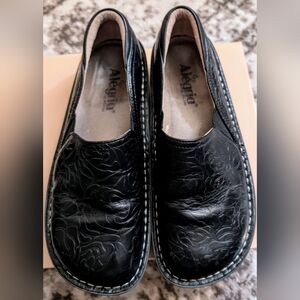 Alegria Black Embossed Slip-On Shoes
